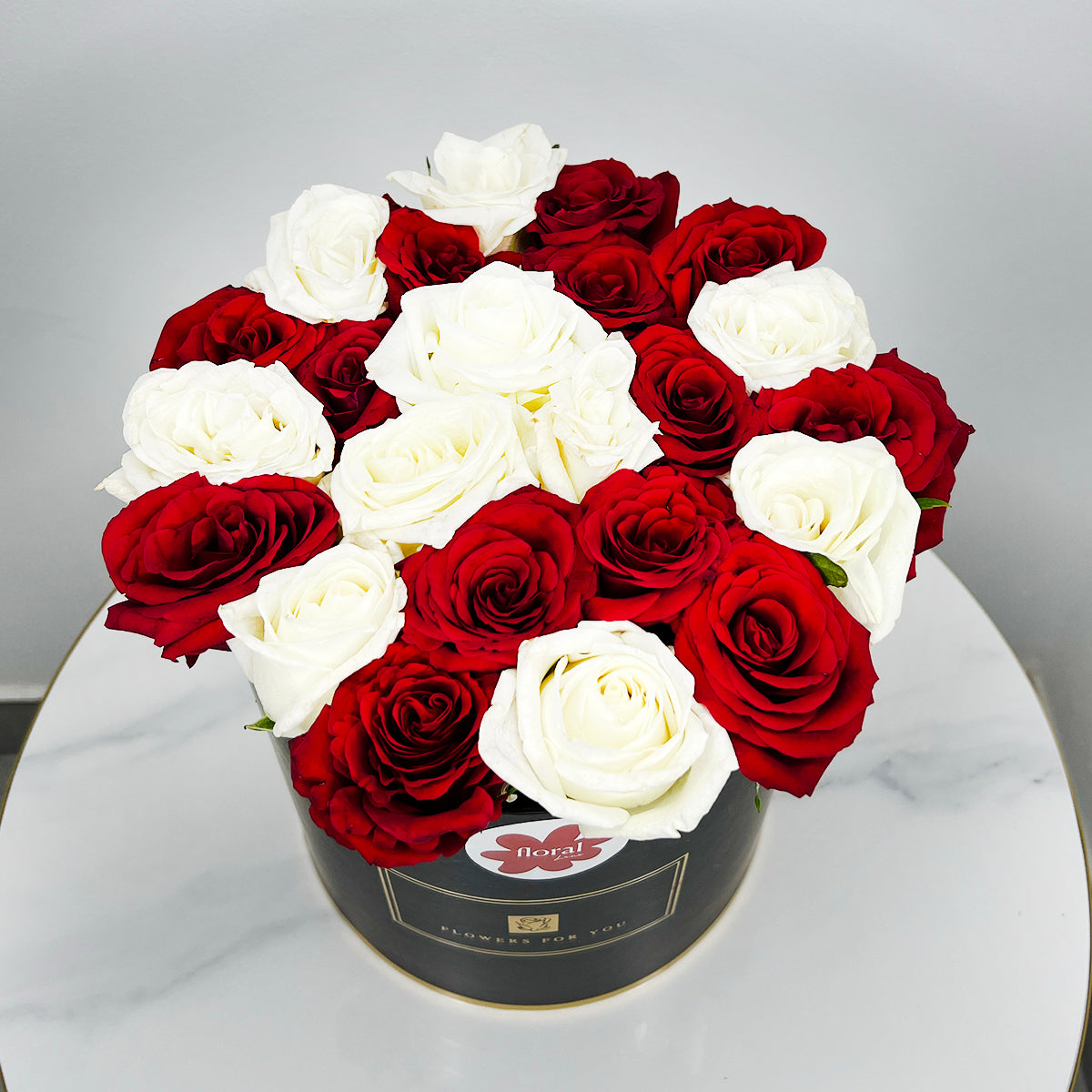 White and Red Roses in a Black Box